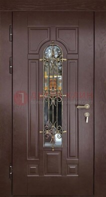 Темная железная дверь со стеклом и ковкой для частного дома ДСК-156 в Вологде
